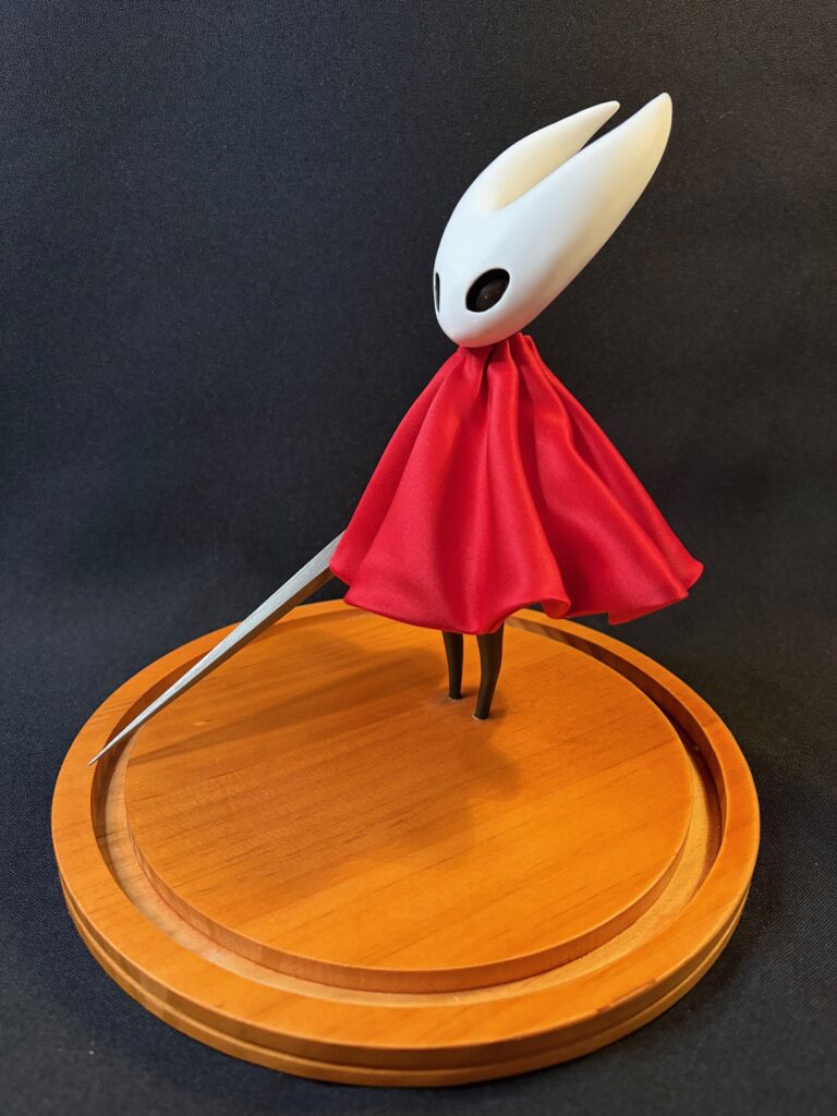 Small scale sculpture of Hornet from Silksong (side)