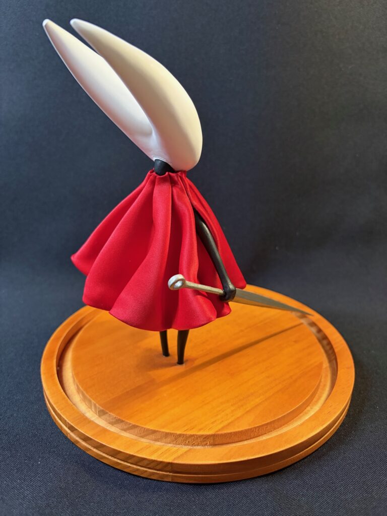 Small scale sculpture of Hornet from Silksong (back)