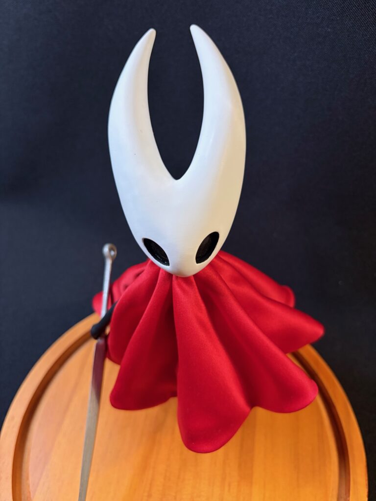 Small scale sculpture of Hornet from Silksong (top)