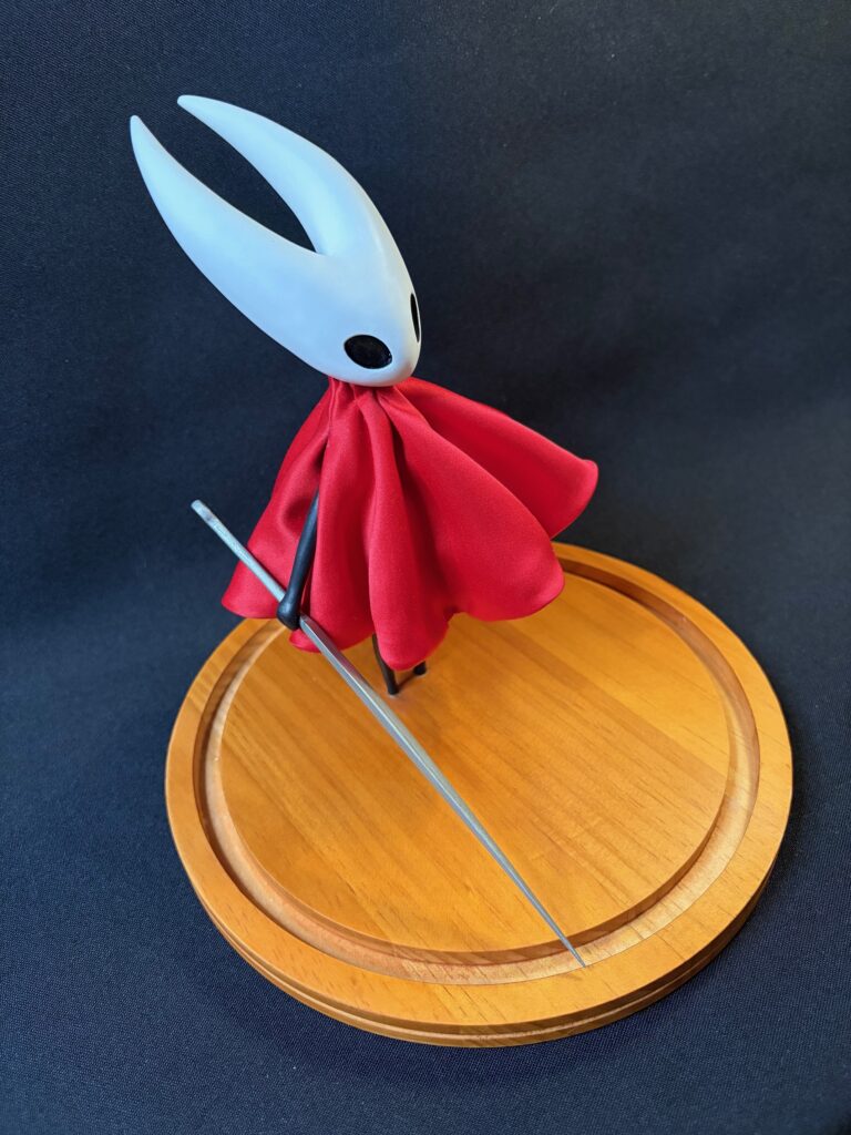 Small scale sculpture of Hornet from Silksong (side)